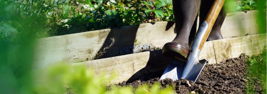 person digging with shovel - contact 811 before digging